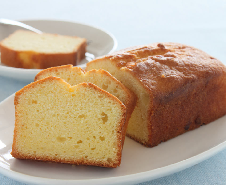 Pound cake with two slices cut off.