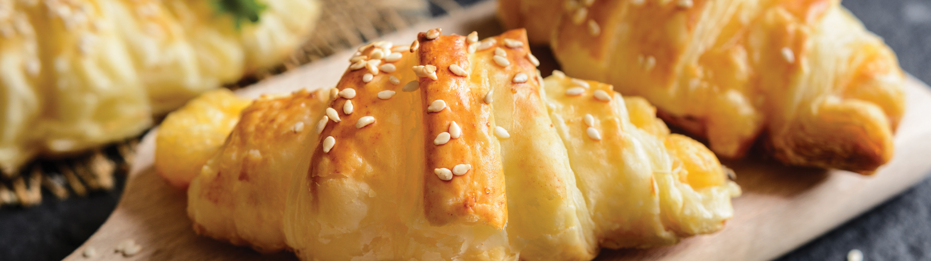 Baked croissants with sesame seed topping.