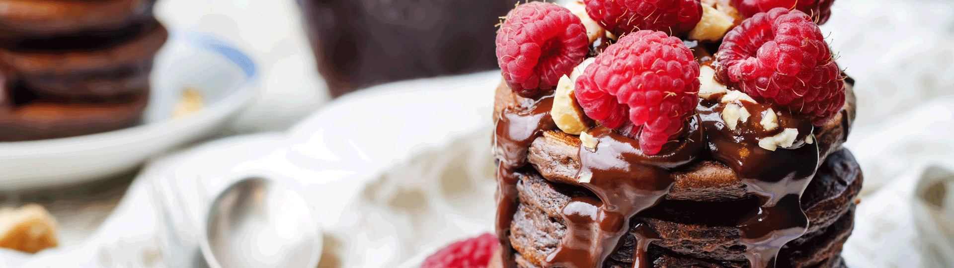 stack of chocolate cakes and raspberries