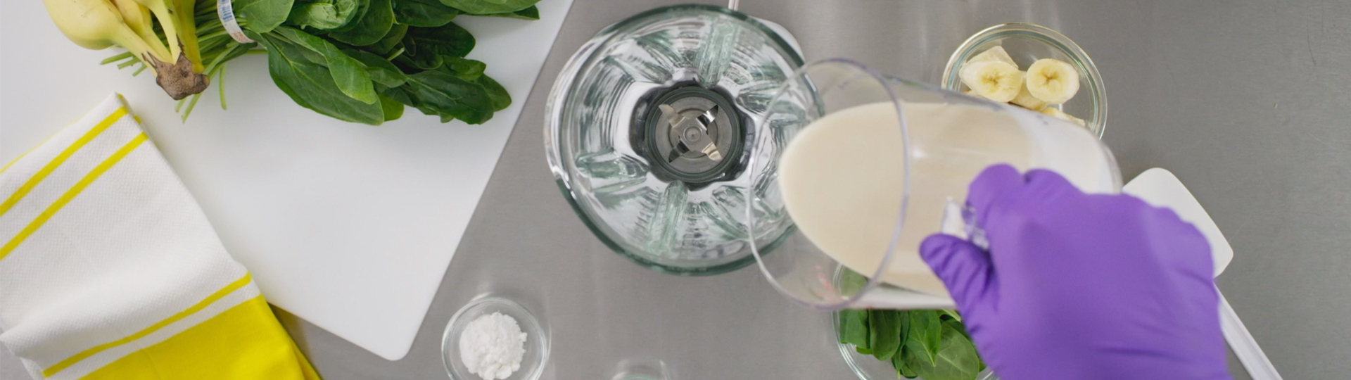 person in lab making a smoothie