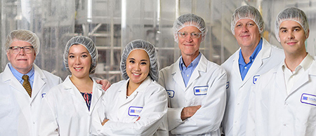 six people in lab coats