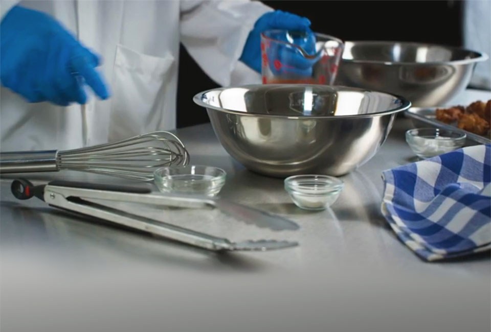 person preparing ingredients in mixing bowls