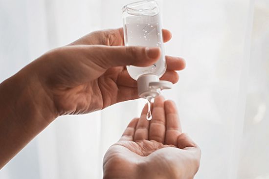 hand sanitizer being applied to hands